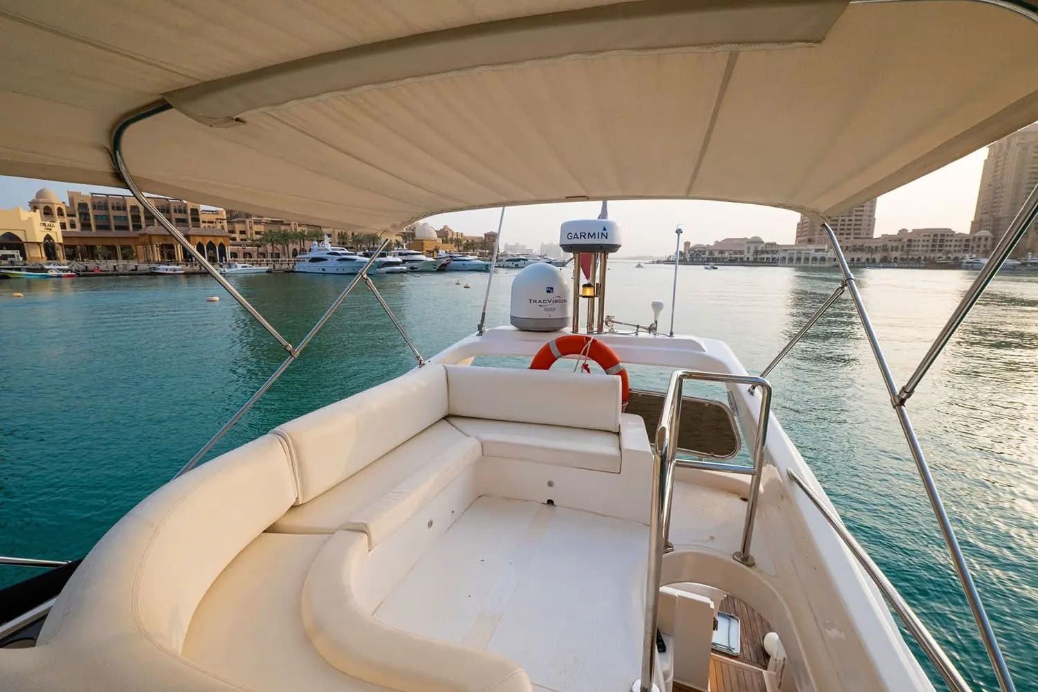 Guests on the bathing platform of a private boat off Doha